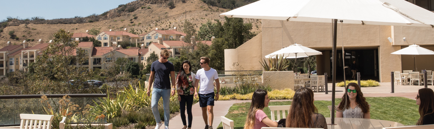 Group of students walking together at Drescher Campus