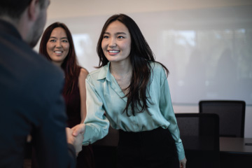 Graziadio student shaking professor hand