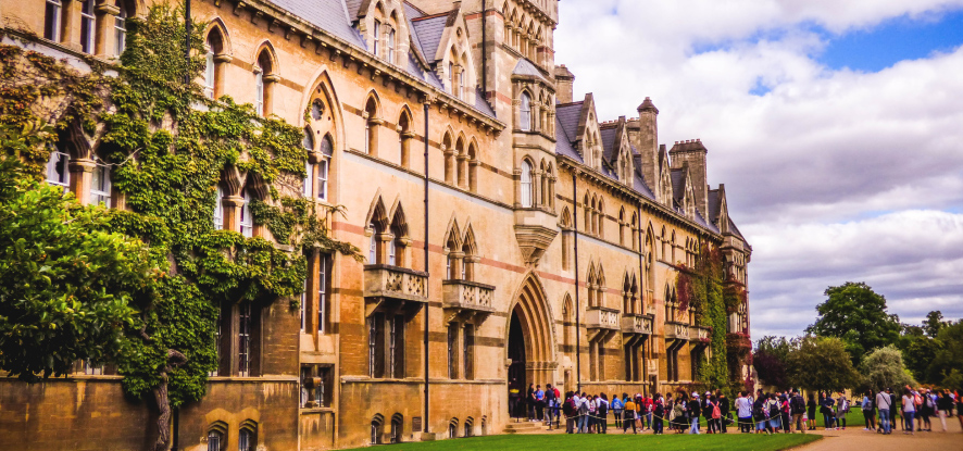 English University building with students outside