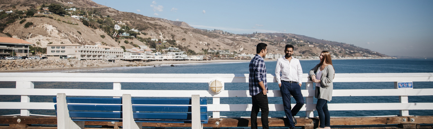 Three Graziadio business students at the Malibu Pier