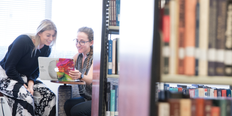 Two graziadio students studying in library