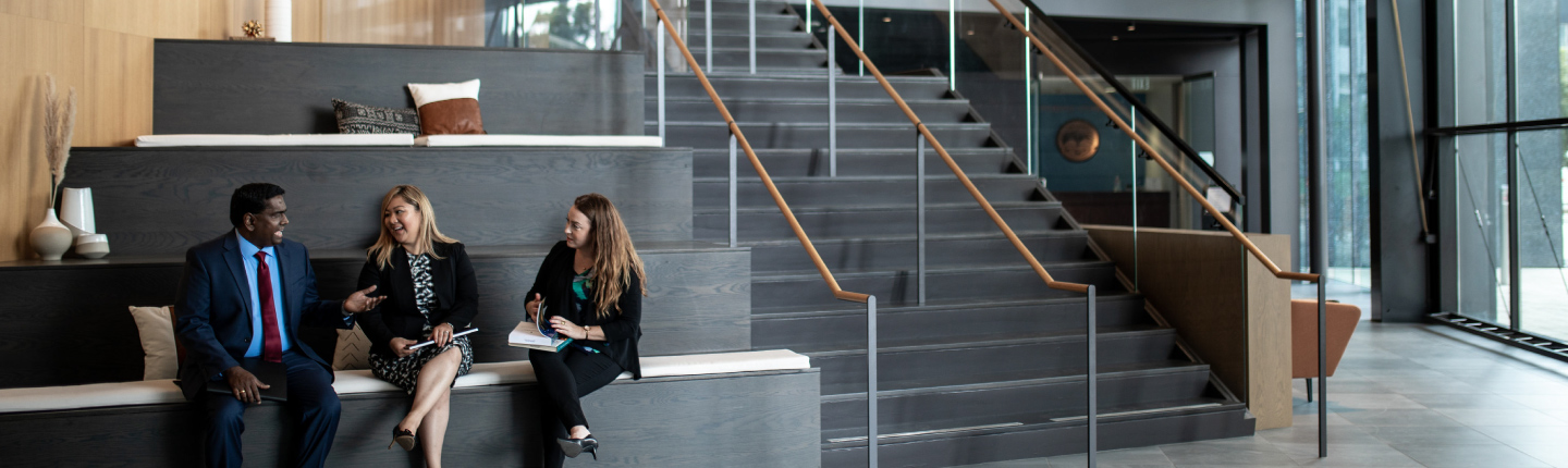 professionals talking on the office stairs