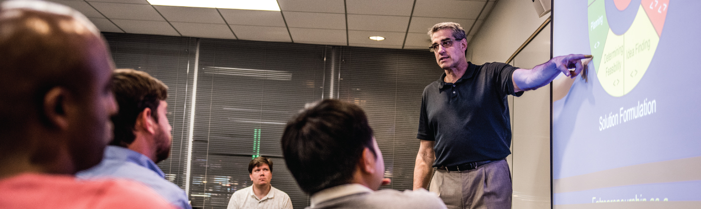 Dr. Larry Cox teaching FEMBA class